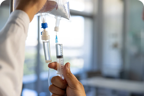 hands biracial male doctor preparing drip sunny hospital room 1024x683.webp